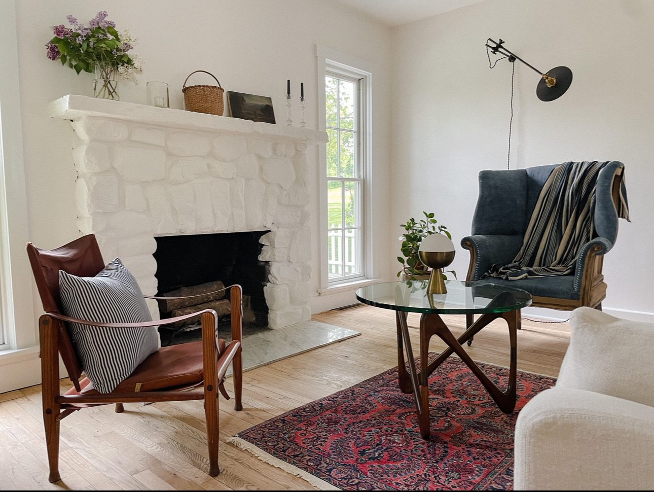 Living room with whitewashed stone fireplace